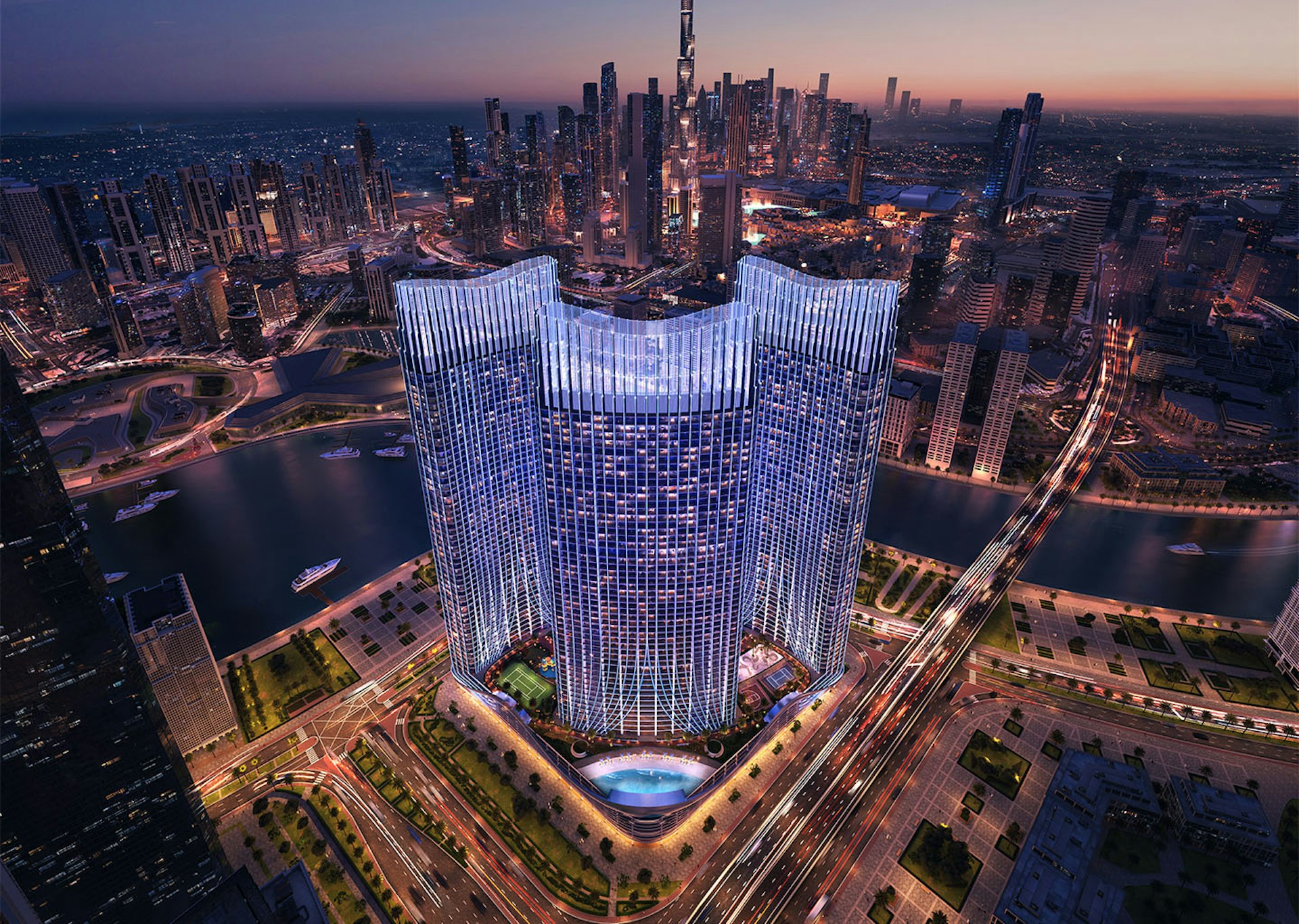 Binghatti Skyrise at night, seen from above Business Bay with Burj Khalifa behind
